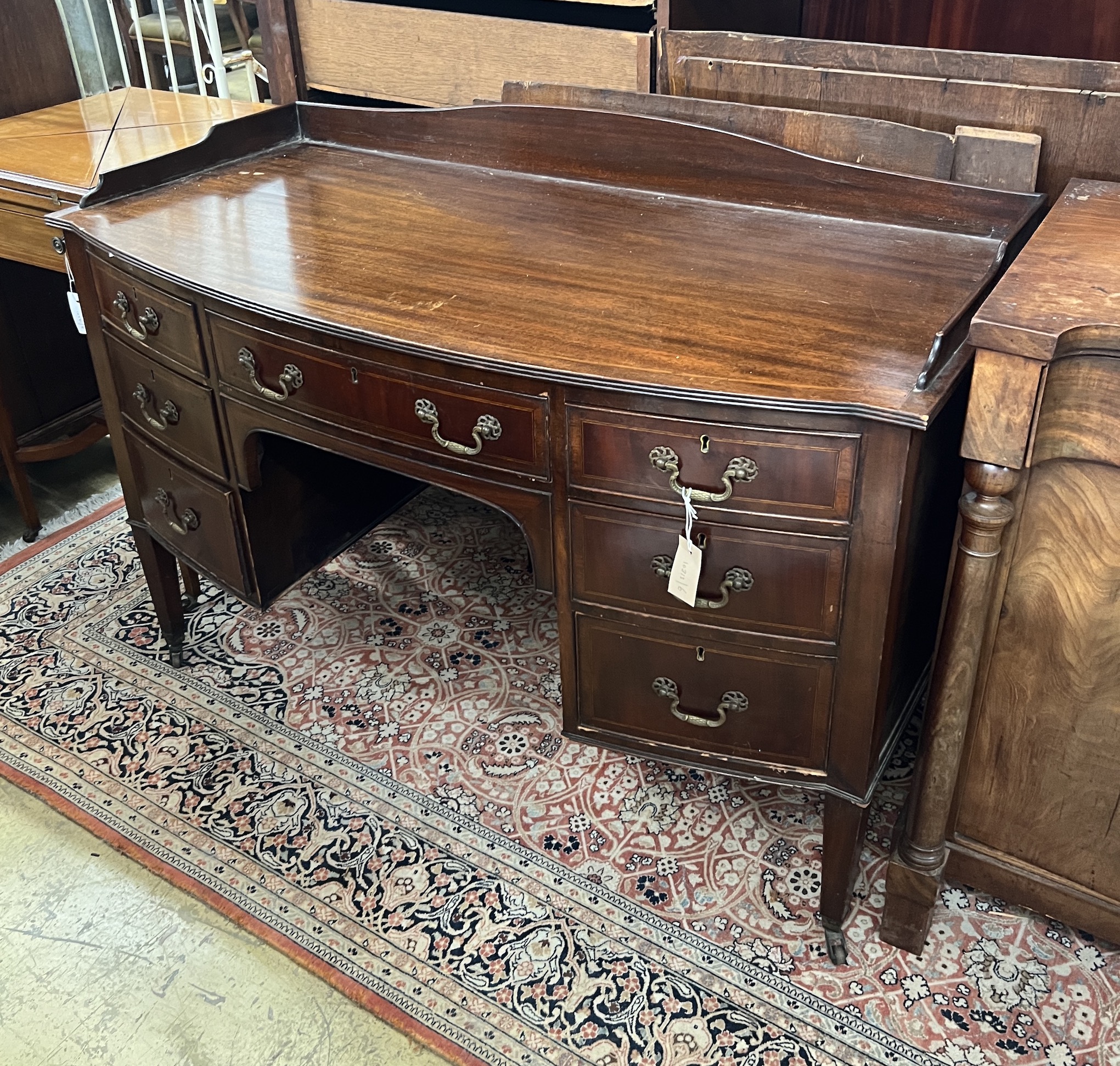 An Edwardian mahogany bow front kneehole washstand, width 122cm, depth 58cm, height 86cm